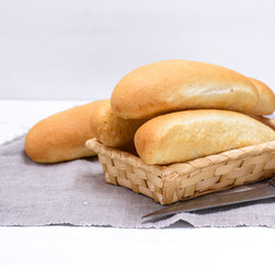 buns of white wheat in a wicker basket