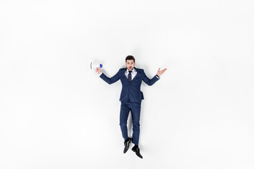 top view of young manager with loudspeaker isolated on white