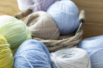Multi-colored woolen balls. Soft focus.