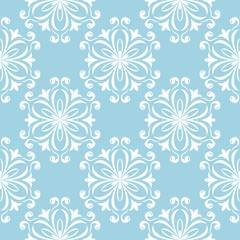 White floral seamless design on blue background