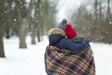 Fototapeta na wymiar Couple in love in winter scenery