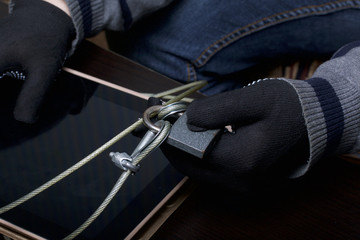 Computer security. Protection of access to data. The tablet is protected by a security cable and a...