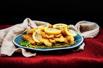 Chinese food fried fish and lemon slices