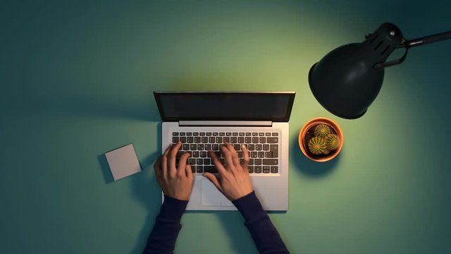 Woman working with her laptop at night