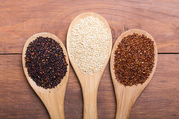 Black , white and red quinoa in spoon