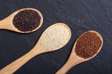 Black , white and red quinoa in spoon