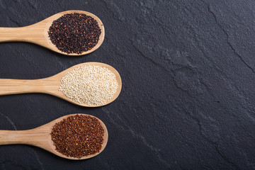 Black , white and red quinoa in spoon