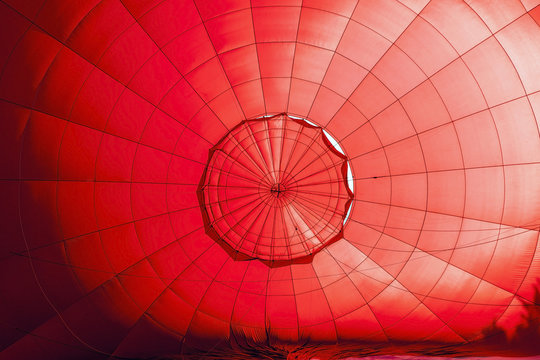 Inside a red hot air balloon in preparation