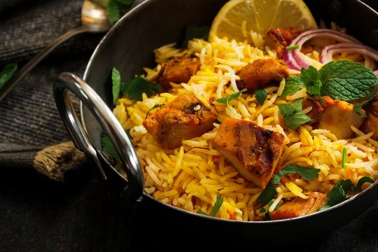 Close Up Of Homemade Chicken Tikka Biryani Served With Raita