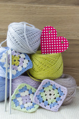Colorful yarn for knitting, decorated with a heart.