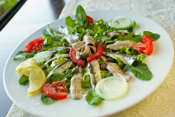 Anchovies served on a plate, konoba, Croatia.