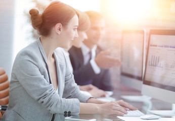 business team discussing financial charts on a workplace