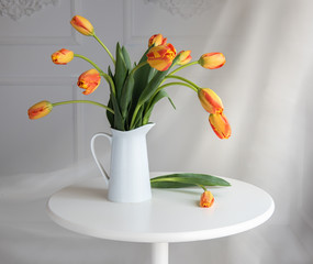 still life with red yellow tulips