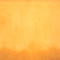 Old painted yellow wall. Blured background.