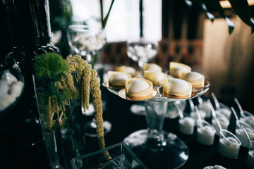 Stylish black dark decoration wedding reception candy bar dessert table