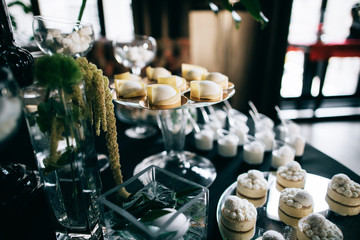 Delicious Stylish black wedding reception candy bar dessert table