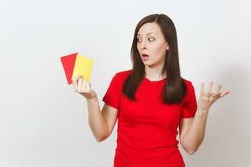 European serious severe young woman, football referee hold choose yellow and red soccer cards, propose player retire from field isolated on white background. Sport, play, healthy lifestyle concept.