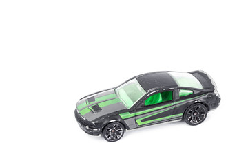 Black toy car isolated on white background.