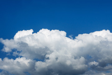 Naklejka na ściany i meble white fluffy clouds against the blue sky