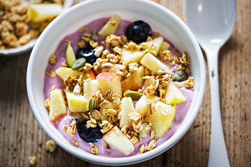 Blueberry yoghurt with apples, blueberries and granola 