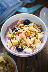 Blueberry yoghurt with apples, blueberries and granola 
