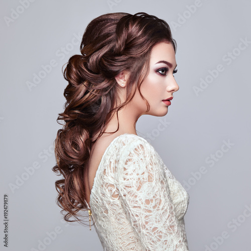 Brunette Woman With Long And Shiny Curly Hair Beautiful