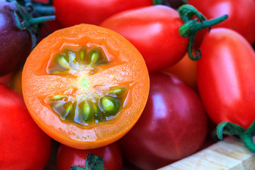Tomatoes on wooden table.