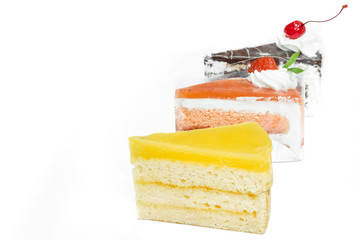 Orange cake, Chocolate cake, Strawberry cake on white background.