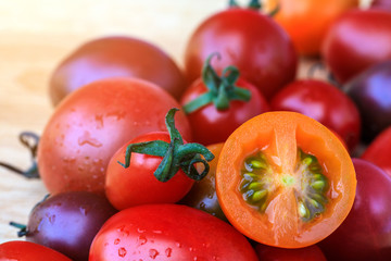 Tomatoes on wooden table.