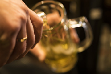 Mug for beer in hand.