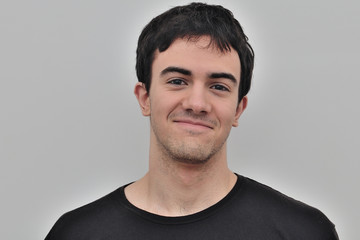 portrait of a joyful young man on a white background