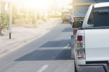 Cars on the road heading towards the goal of the trip.or stop on the road by traffic jam.