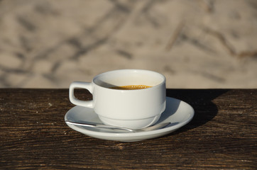 Coffee cup top view on old wooden