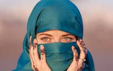 Arabian Moroccan woman with blue scarf in Morocco