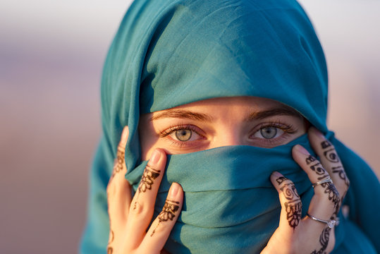 Arabian Moroccan woman with blue scarf in Morocco