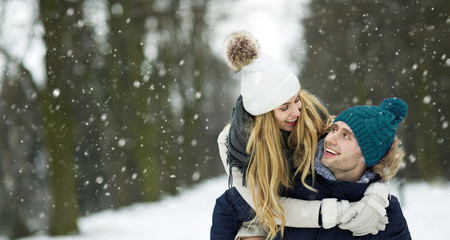 Couple in love in winter scenery

