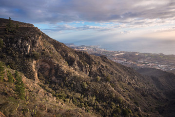 Tenerife mountain landscape. Trekking path. Adeje and Las Americas coastline in the background.