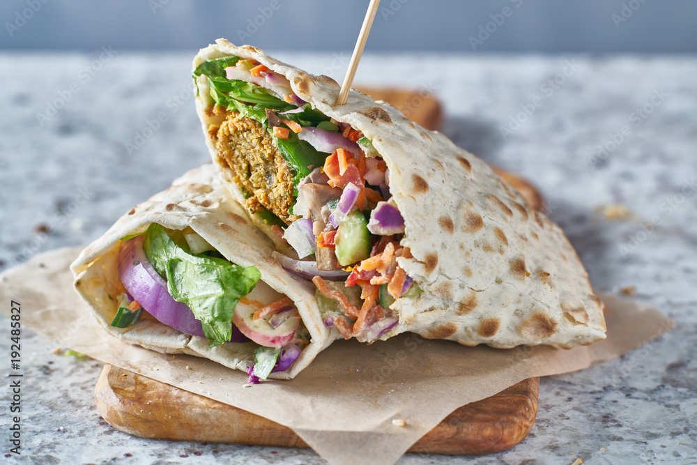 Wall mural vegan food- tasty falafel wrap in gluten free bread