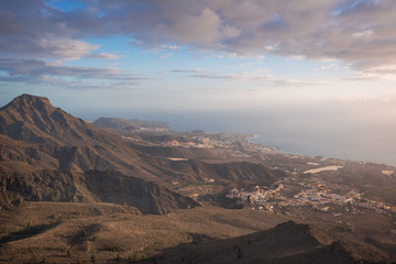 Fototapeta na wymiar Tenerife mountain landscape. Adeje and Las Americas coastline in the background.