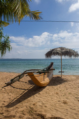 Sand and fishing boats on the beach.