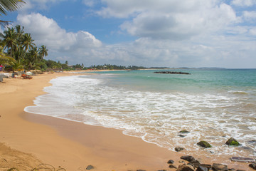 Beautiful beach. View of nice tropical beach with palms around. Holiday and vacation concept....