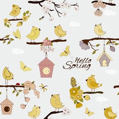 Seamless floral pattern with cute cartoon birds on the branches