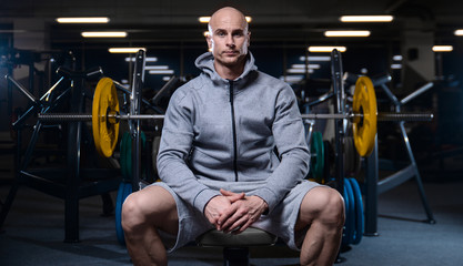 Brutal strong bodybuilder athletic men pumping up muscles with dumbbells