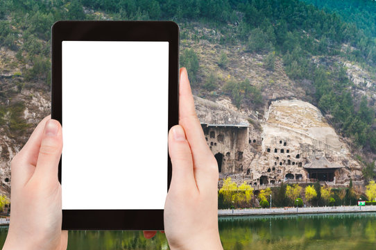 tourist photographs Longmen Caves in China