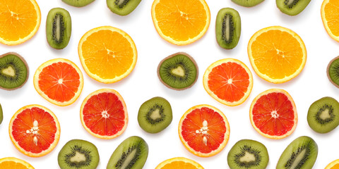 Seamless pattern of fresh fruits: red oranges, kiwi, isolated on white background, top view, flat lay. Food texture background. Healthy food, detox, diet.