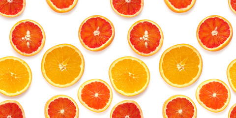 Seamless pattern of fresh oranges isolated on white background, top view, flat lay. Food texture background. Healthy food, detox, diet.