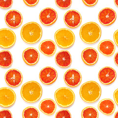Seamless pattern of fresh oranges isolated on white background, top view, flat lay. Food texture background. Healthy food, detox, diet.