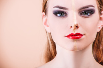 Fototapeta premium Close-up of a young girl face with creative visage face art