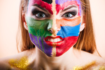 Close-up of a young girl face with creative visage face art