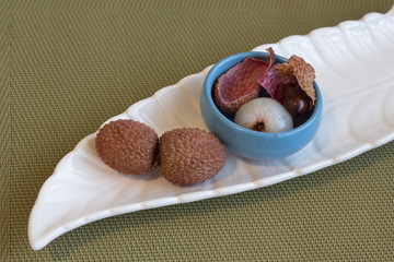 Close-up of litchi fruit - whole and peeled. And his shiny stone..